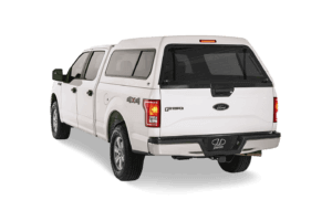 white Ford F150 with a mid-rise truck cap